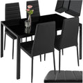Ensemble repas avec table rectangulaire en verre trempe et quatre chaises confortables en cuir synthetique noir